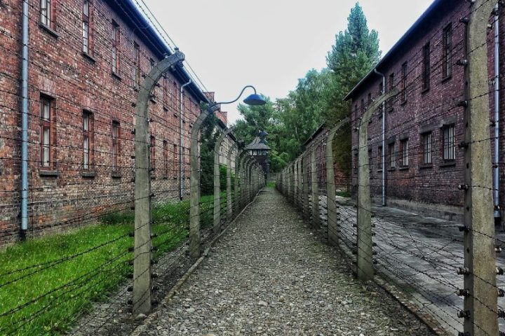 a narrow road next to a brick building