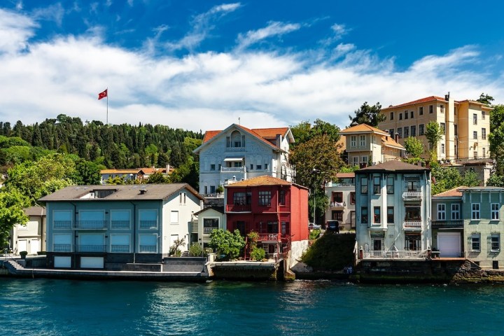 a boat is docked next to a body of water