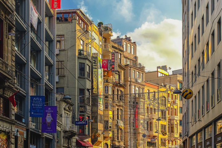 a crowded city street surrounded by tall buildings