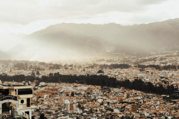 a group of people standing on top of a mountain