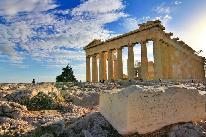 a stone building with a large rock