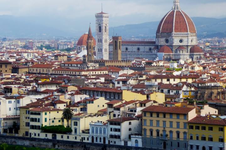 a view of a city with large buildings in the background