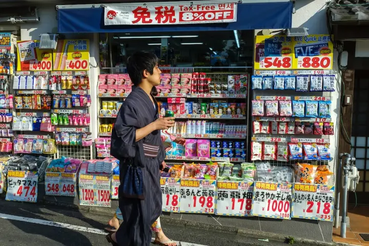 a person standing in front of a store