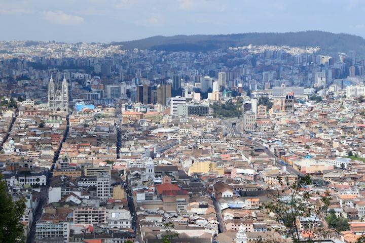 a large body of water with a city in the background